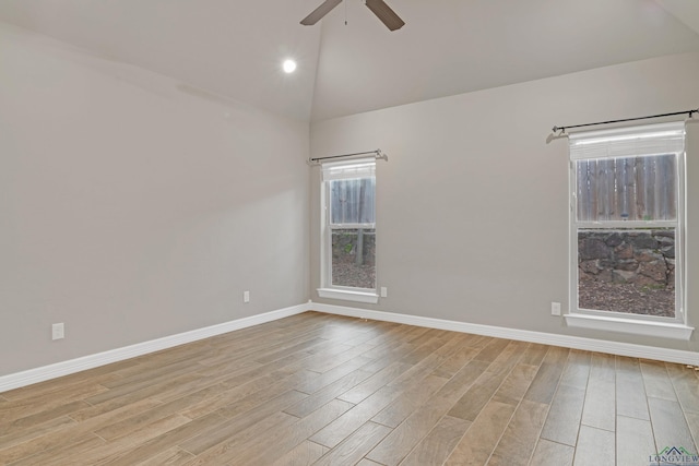 unfurnished room featuring vaulted ceiling, ceiling fan, and light hardwood / wood-style floors