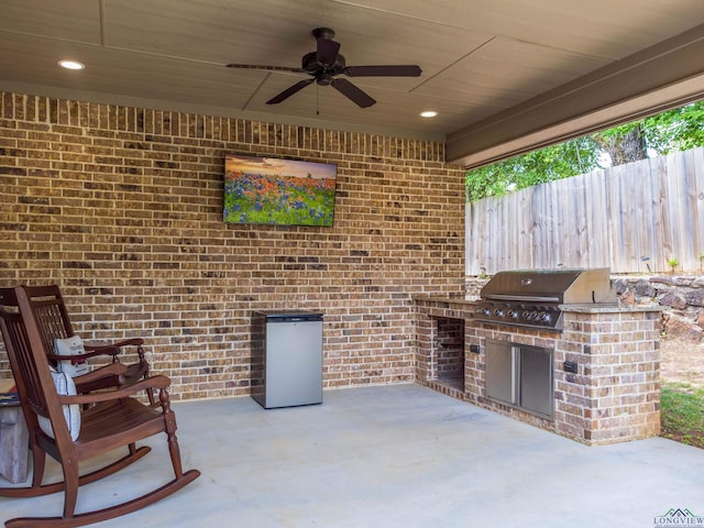 view of patio / terrace with ceiling fan, area for grilling, and grilling area