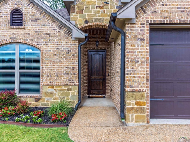 entrance to property featuring a garage