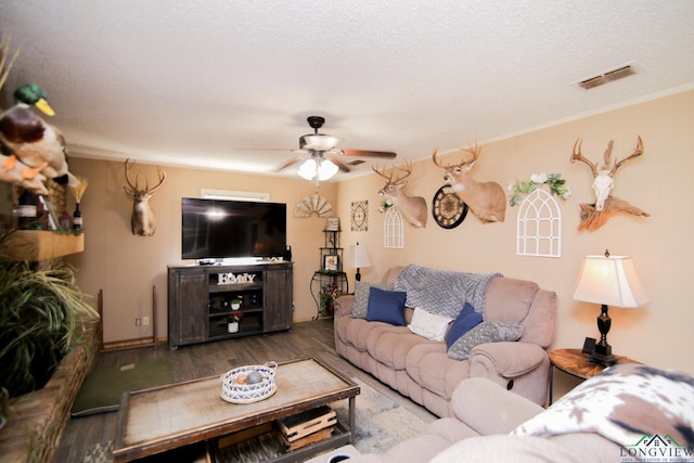 4540 Smelley Rd, Longview, TX 75605 - living room featuring visible vents, a textured ceiling, wood finished floors, crown molding, and ceiling fan