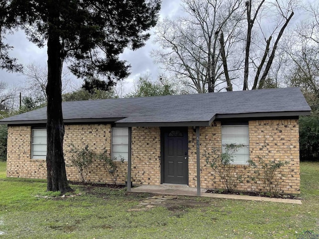 ranch-style house with a front yard