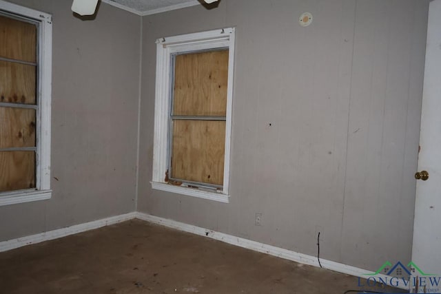 empty room with concrete flooring