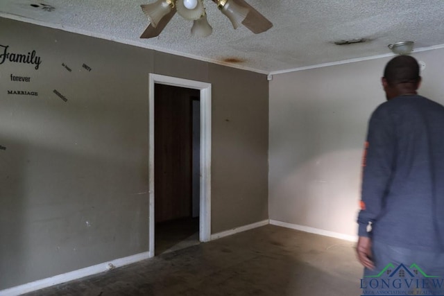 unfurnished room featuring ceiling fan, crown molding, and a textured ceiling