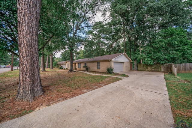 ranch-style house with a front lawn and a garage