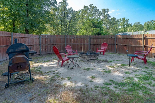 view of patio / terrace featuring a grill and an outdoor fire pit