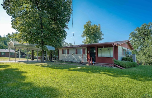 ranch-style house with a front lawn and a carport