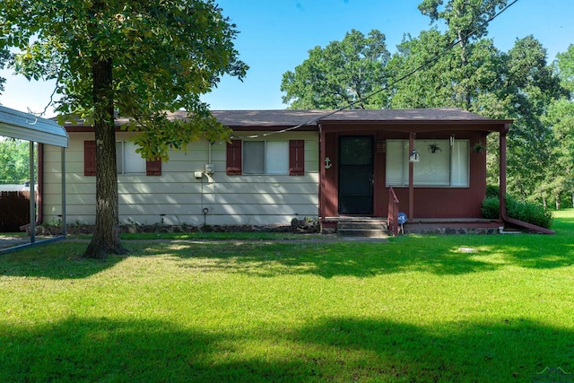 single story home featuring a front lawn