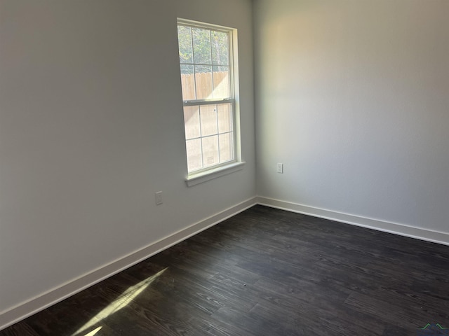 2808 Park Dr, Marshall, TX 75670 - empty room with baseboards and dark wood-type flooring