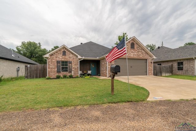 view of front facade featuring a front yard and a garage