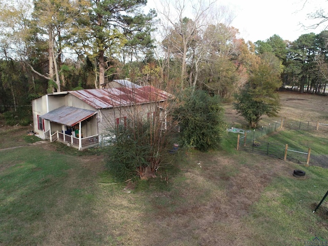 exterior space with a rural view and a porch