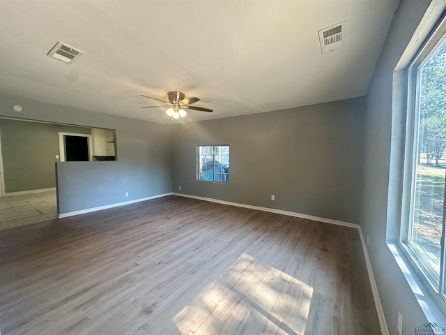 empty room featuring ceiling fan and light hardwood / wood-style flooring