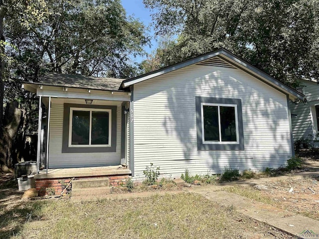 view of property exterior with covered porch