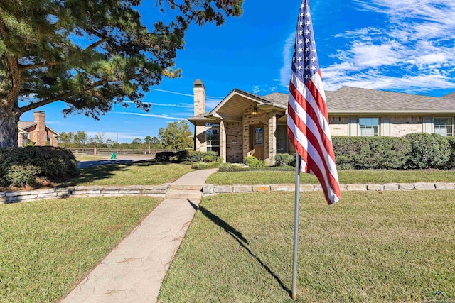 view of front of house with a front lawn