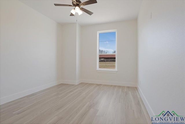 unfurnished room with ceiling fan and light wood-type flooring