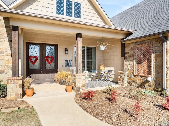 view of exterior entry with covered porch