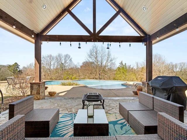 view of patio / terrace with a gazebo, area for grilling, and an outdoor living space