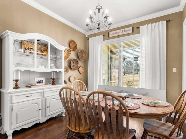 dining area with crown molding, dark hardwood / wood-style floors, and an inviting chandelier