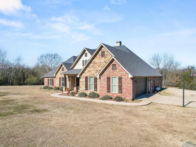 craftsman inspired home featuring a garage and a front lawn