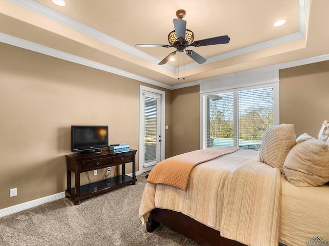 bedroom with access to exterior, ornamental molding, a raised ceiling, and carpet flooring