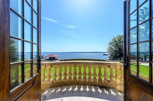 balcony featuring a water view