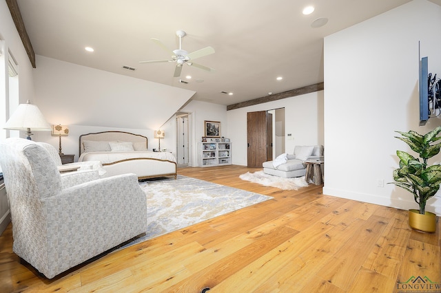 bedroom featuring hardwood / wood-style floors and ceiling fan