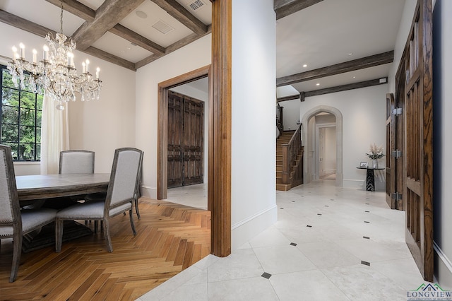 dining room featuring beamed ceiling, light parquet flooring, and a chandelier