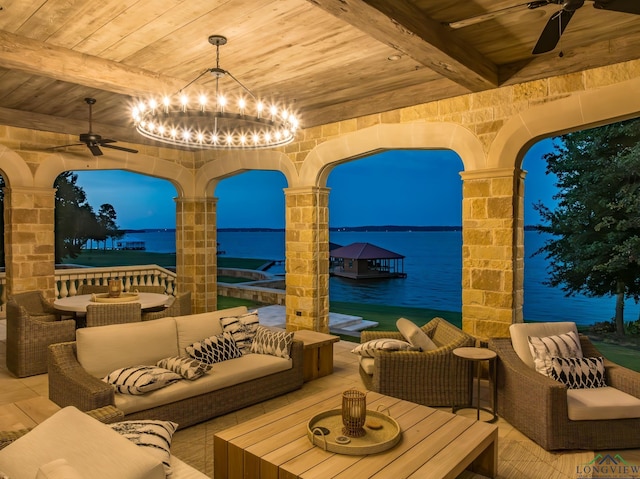 patio terrace at dusk with a water view and an outdoor hangout area