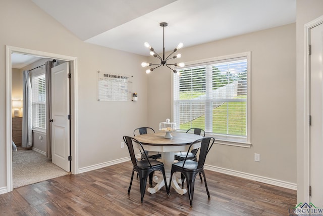 144 Brenlind Ln, Mineola, TX 75773 - dining area featuring dark wood-style floors, a chandelier, and lofted ceiling