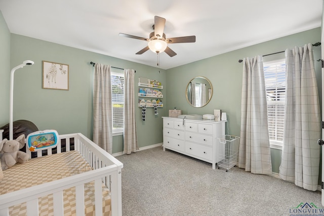 144 Brenlind Ln, Mineola, TX 75773 - carpeted bedroom with a nursery area and ceiling fan