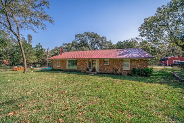 single story home featuring a front yard