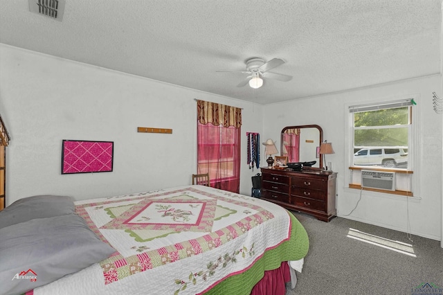 bedroom featuring carpet flooring, ceiling fan, cooling unit, and a textured ceiling