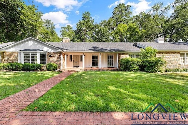 ranch-style house featuring a front yard and a porch