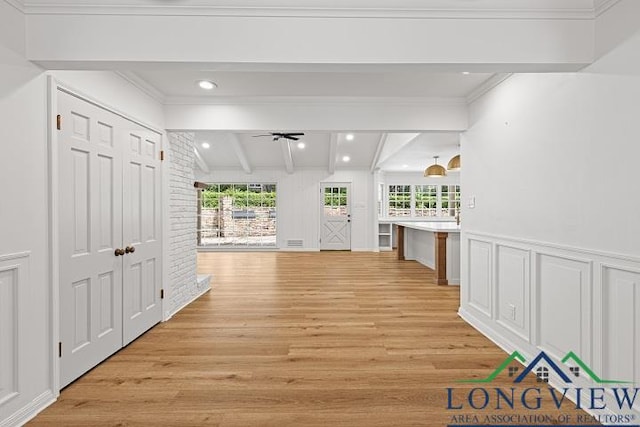 corridor featuring vaulted ceiling with beams and light hardwood / wood-style floors