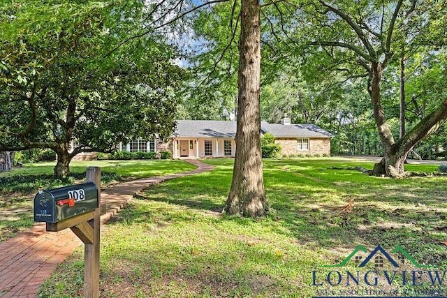 ranch-style house with a front yard