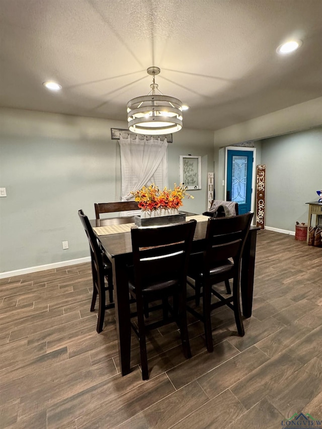 dining room featuring a textured ceiling