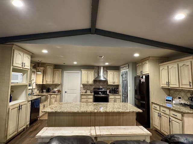 kitchen featuring dark wood-type flooring, black appliances, a center island, and wall chimney exhaust hood