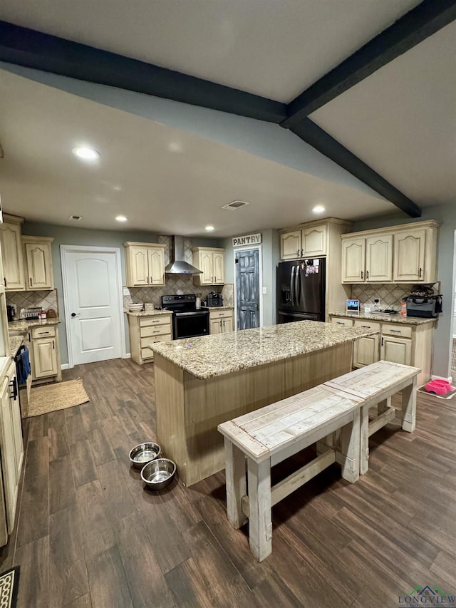 kitchen with dark hardwood / wood-style floors, a center island, wall chimney exhaust hood, black appliances, and beamed ceiling