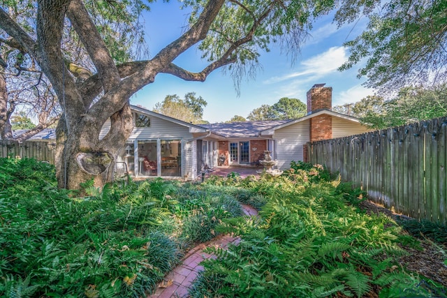 back of house featuring a patio and french doors