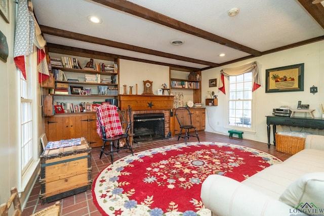 tiled living room featuring a fireplace, beamed ceiling, and a textured ceiling