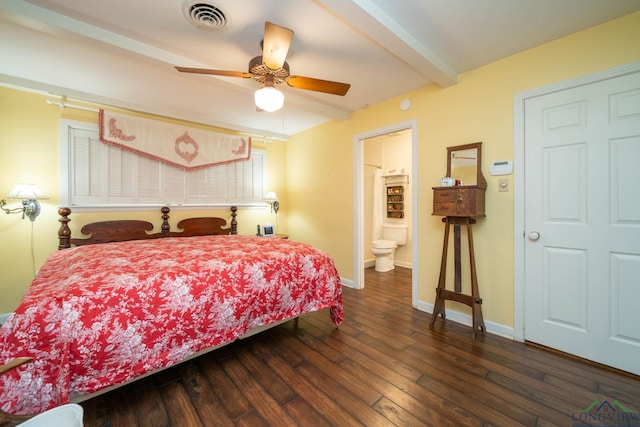 bedroom featuring beam ceiling, ensuite bath, ceiling fan, and dark wood-type flooring