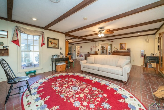 living room featuring ceiling fan and beam ceiling