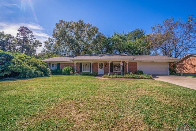 single story home with a garage and a front lawn