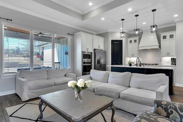 living room with ornamental molding, plenty of natural light, and dark hardwood / wood-style floors