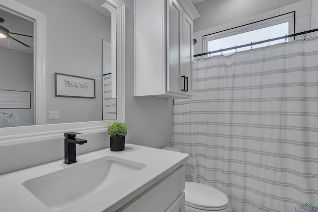 4205 Savannah Hills Ln, Longview, TX 75605 - bathroom with vanity, ceiling fan, and curtained shower