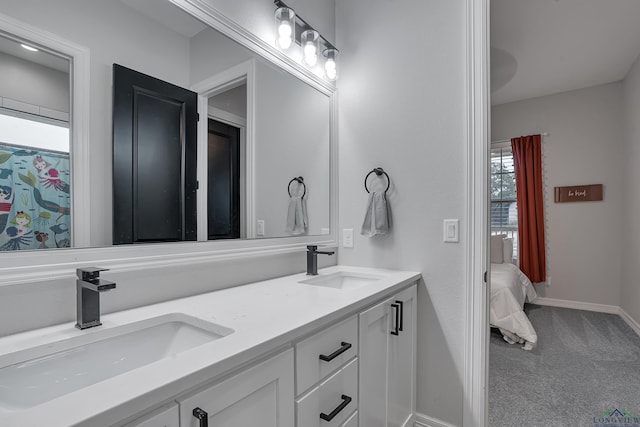 4205 Savannah Hills Ln, Longview, TX 75605 - full bathroom with double vanity and baseboards
