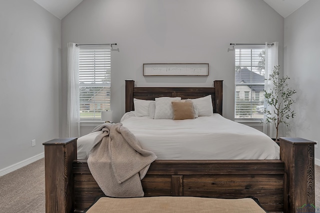 bedroom with lofted ceiling and carpet flooring