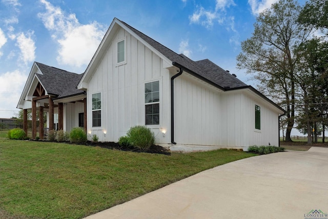 view of side of home featuring a lawn