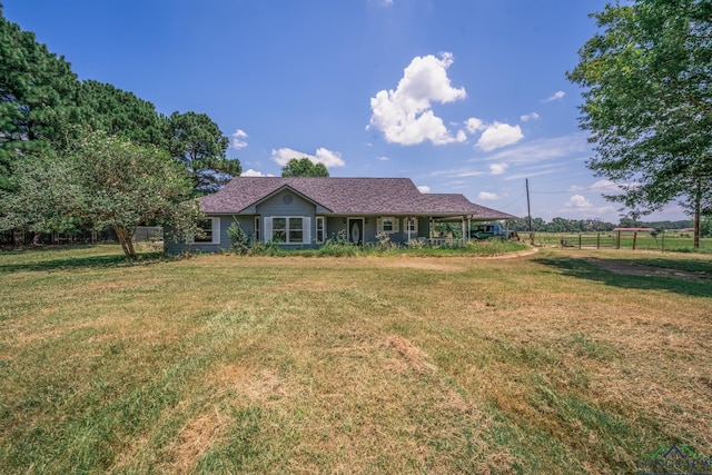 single story home featuring a front lawn