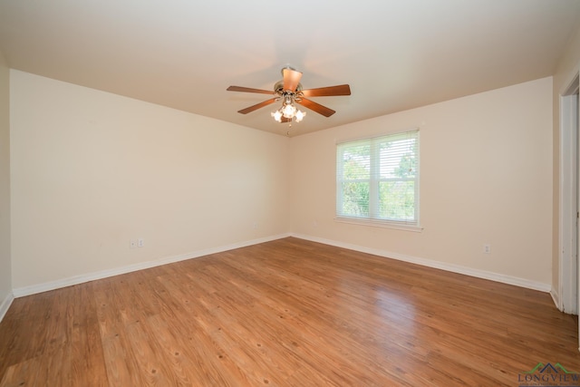 empty room with ceiling fan and light wood-type flooring