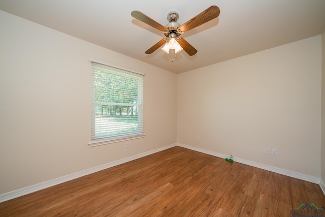 unfurnished room featuring hardwood / wood-style flooring and ceiling fan